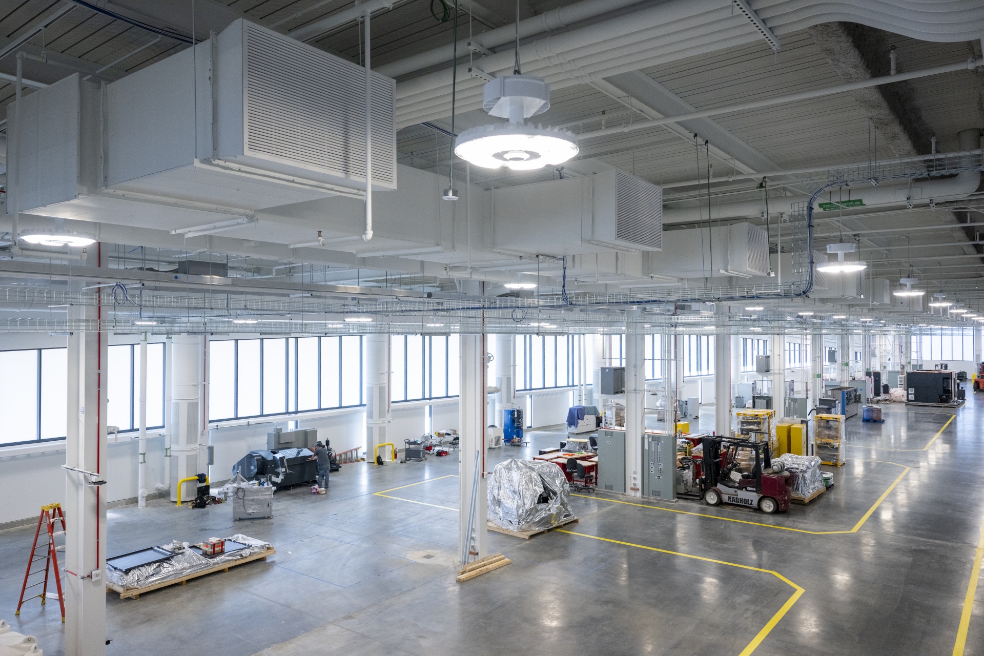 A large open area for industrial manufacturing equipment awaits its next cutting edge project.